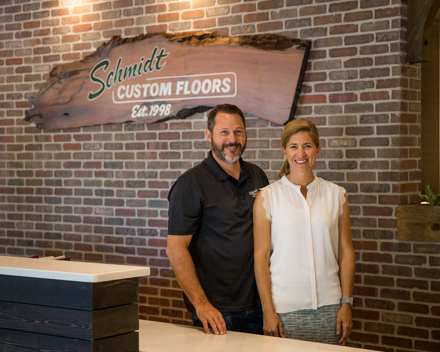 Barry and Alyssa Schmidt in the Schmidt Custom Floors Loveland showroom